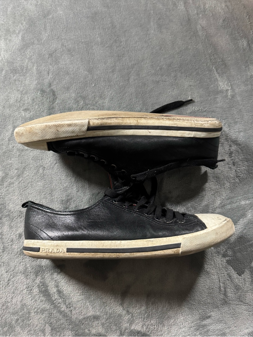 Prada Black Leather Low-Top Sneakers with White Rubber Trim